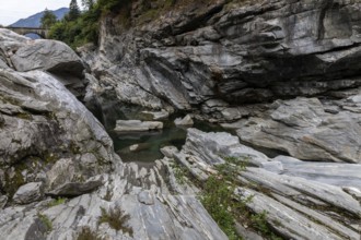 Rocks, granite rock formations in the Maggia River near Ponte Brolla, in the Maggia Valley, Valle