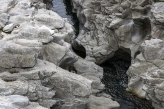 Rocks, granite rock formations in the Maggia River near Ponte Brolla, in the Maggia Valley, Valle