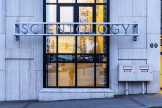 Scientology, headquarters of the sect, exterior view in the evening with Scientology cross.