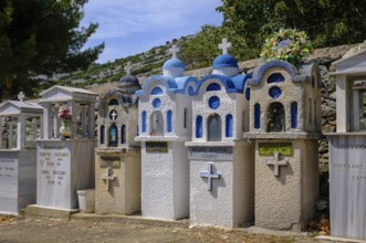 Theologos, Thassos, Greece - Greek Orthodox cemetery with traditional small prayer chapels in the