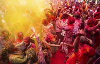 Revellers smear with Gulal or coloured powder and dance to play Holi, the Hindu spring festival of