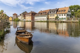 Rowing boat on the Regnitz, in the background residential buildings at Mühlwörth, Bamberg, Bavaria,