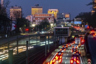 Motorway A40, Ruhr expressway, heavy traffic jam, rush hour, city passage in Essen, skyline of the
