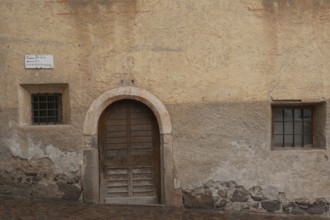 View of a wooden door and window of an old building, St.Peter, Villnöß, Funes, Villnößtal, South