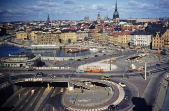 Vehicles using the new overpass system in the city centre of Stockholm, Sweden 1958, drive on the