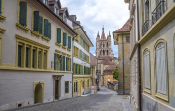 Alley in the Cité and tower of Notre Dame de Lausanne Cathedral, historic old town, Lausanne, Vaud,