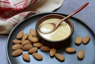 White almond cream in small bowls, almond butter