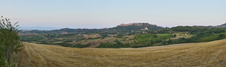Typical Tuscan landscape, Montepulciano village with San Biagio Renaissance Church at sunset in