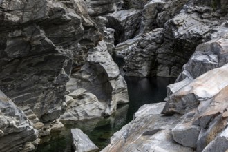 Rocks, granite rock formations in the Maggia River near Ponte Brolla, in the Maggia Valley, Valle