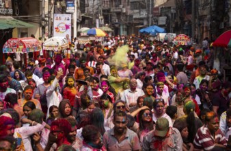 Revellers smear with Gulal or coloured powder and dance to play Holi, the Hindu spring festival of