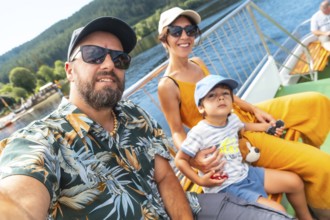 Selfie of a family on vacation in summer at Lake Titisee in the Black Forest, Germany, Europe