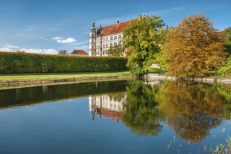 Güstrow Castle in autumn with water spouting, built in the 16th century, Renaissance building,