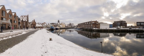 Panorama of the old town and harbour with water gate, St. Mary's Church and St. George's Church in