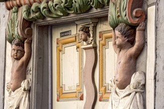 House Ohlschlaeger, historic half-timbered house of the Baroque period, portal with atlases, putti