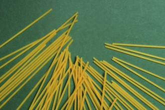 Spaghetti on a green background, pasta, pasta products