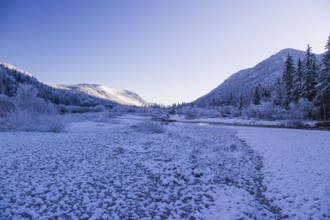 Isar valley in winter at temperatures of minus 18 degrees Celsius. Snow covered landscape with the