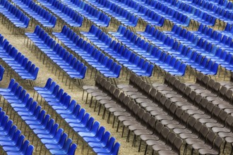 Blue and black rows of chairs in the audience area of the summer festival in Lucca, Tuscany, Italy,