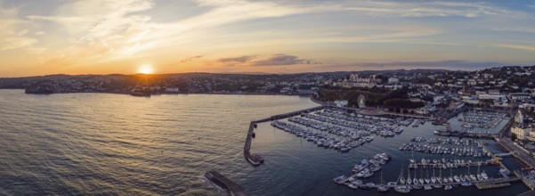 Sunset over Torquay Harbour and Marina, English Riviera from a drone, Devon, England, United