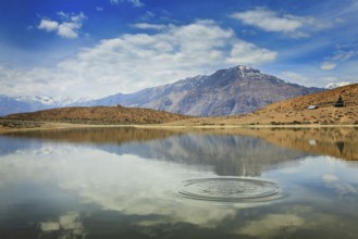Himalayas mountains refelcting in mountain lake Dhankar Lake. Spiti Valley, Himachal Pradesh,