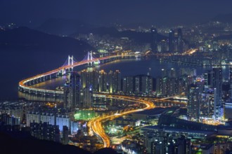 Busan cityscape with skyscrapers and Gwangan Bridge illuminated at night. Busan. South Korea