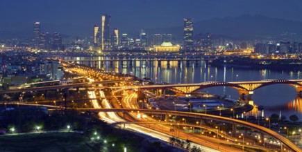 Aerial panorama of Seoul downtown cityscape and Seongsan bridge over Han River in twilight. Seoul,