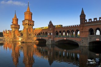 Oberbaum Bridge over the Spree with yellow underground, Friedrichshain-Kreuzberg district, Berlin,