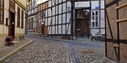 Half-timbered houses in the Finkenherd alley with cobblestones, Old Town of the World Heritage town