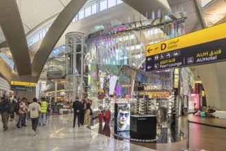 Abu Dhabi Airport, Zayed International Airport with passengers. Duty free shop. The new Terminal A