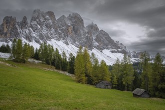 View of a part of the Geisler group in the foreground two mountain huts, Dolomites, snow,