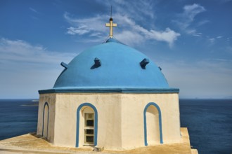 Blue church tower with sea view under a blue sky, Greek architecture, Church of Agios Georgios,