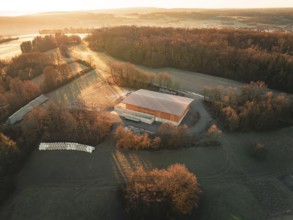 Photograph of a building in a rural setting with long shadows at dusk, Gechingen, Heckengäu region,