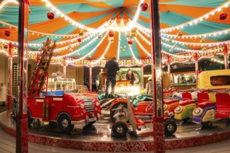A colourful carousel with fairy lights in a lively night-time atmosphere, Ludwigsburg Christmas