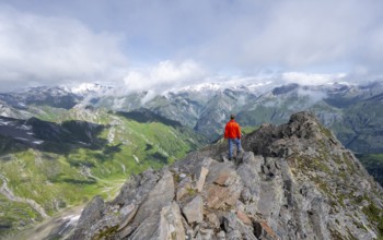 Mountaineer on the summit of Lasörling, view of the mountain panorama of the Venediger Group,