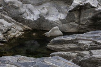 Rocks, granite rock formations in the Maggia River near Ponte Brolla, in the Maggia Valley, Valle