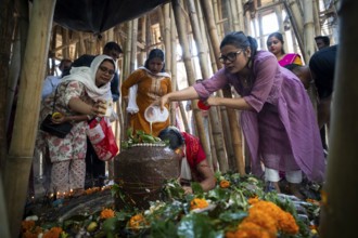 Devotees offer prayers to a Shiva linga on the occasion of Maha Shivaratri, on February 26, 2025 in