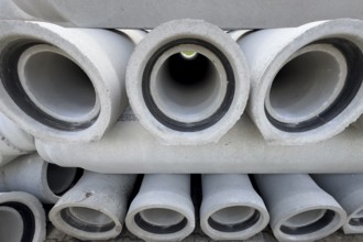 Stacked concrete pipes Sewer pipes for laying Pipe laying in road construction for sewage Rainwater