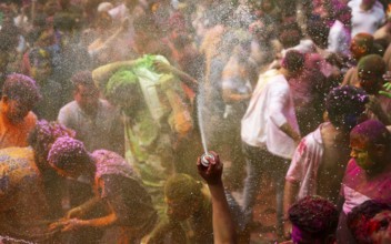 Revellers smear with Gulal or coloured powder and dance to play Holi, the Hindu spring festival of