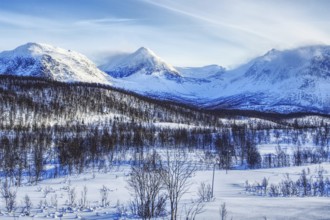 Impressive snow-covered mountain landscape under a blue sky, Norway, Europe