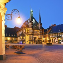 Market square with atmospherically illuminated town hall in the evening, Wernigerode, Harz,