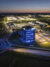 Night scene with illuminated building and streets in a rural setting, Mobex, Nagold, Black Forest,