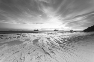 Structures in the sand, sunrise at low tide on the beach of Koh Ngai Island, Andaman Sea, Satun