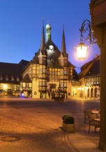 Market square with atmospherically illuminated town hall in the evening, Wernigerode, Harz,