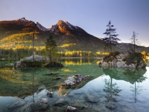 Hintersee in the morning in the first sunlight, behind the peaks of the Hochkalter, Berchtesgaden