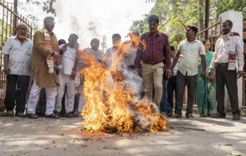Members of the Congress Party burn an effigy named 'Pakistani Terrorist' as they protest over