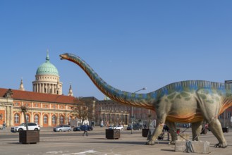 Large figure of a brontosaurus from a dinosaur exhibition in front of the film museum in the