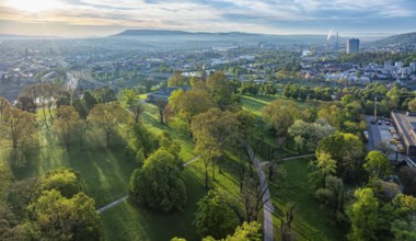 Rosensteinpark in the early morning, view of the cityscape of Bad Cannstatt. Aerial view.