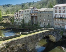 Olliergues village. Old bridge on river Dore. Natural regional park of Livradois Forez. Puy de Dome