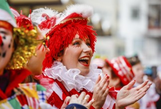 Colourfully costumed carnivalists celebrate carnival in Cologne, on Weiberfastnacht the street