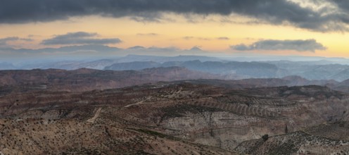 Sunrise, wide hilly desert landscape with dry vegetation, Gorafe desert, semi-desert, Granada,