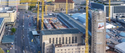 Stuttgart main station with Bonatzbau. Stuttgart 21 construction site with station tower and crane.